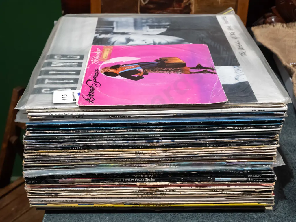 stack of various LPs, Donna Summer 45 Image 1++