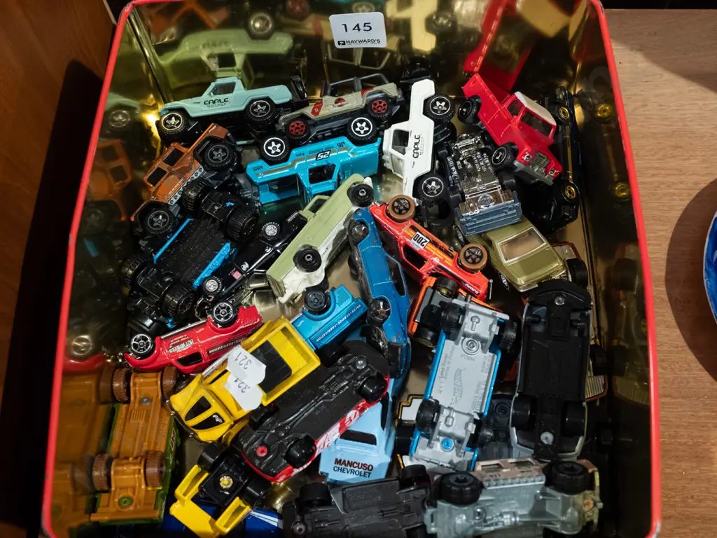 cake tin and toy vehicles Image 1++