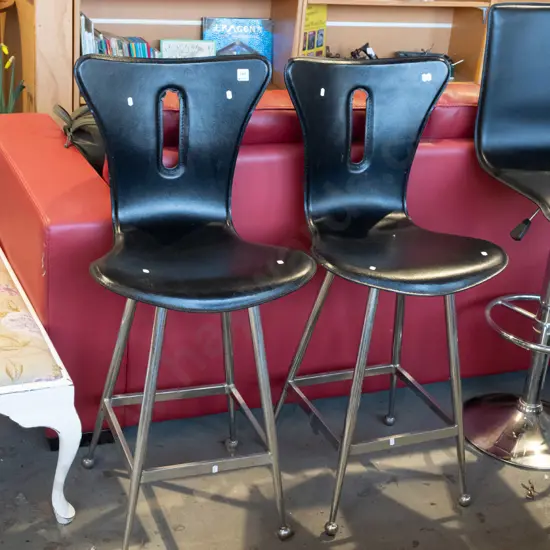 2x leather upholstered stools - both have some damage to backs