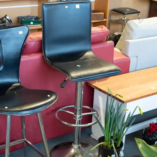 black vinyl and chrome adjustable bar stool