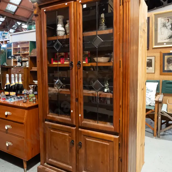 Outback Furniture pine 4 door cupboard with 2 glazed leadlight doors - some scuffing and marks to varnish H1805 W1010 D3