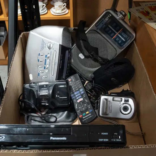 box; radios, blue ray player, 35mm camera etc