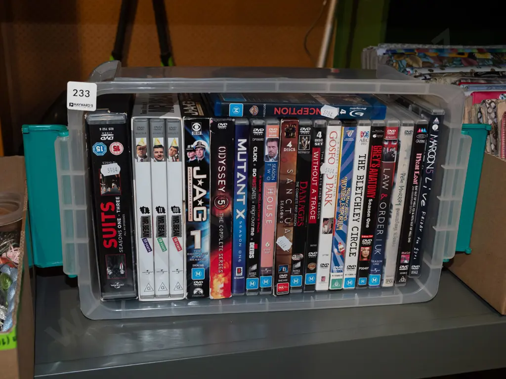 plastic tub of DVDs Image 1++