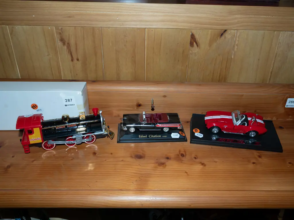 model train and 2x diecast model vehicles on plastic stands Image 1++