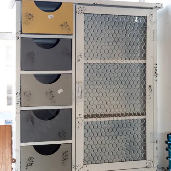 white painted metal distressed cabinet with 5 drawers, 1 chicken wire door