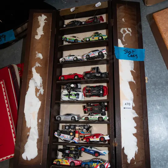 wooden box of numerous small slot cars