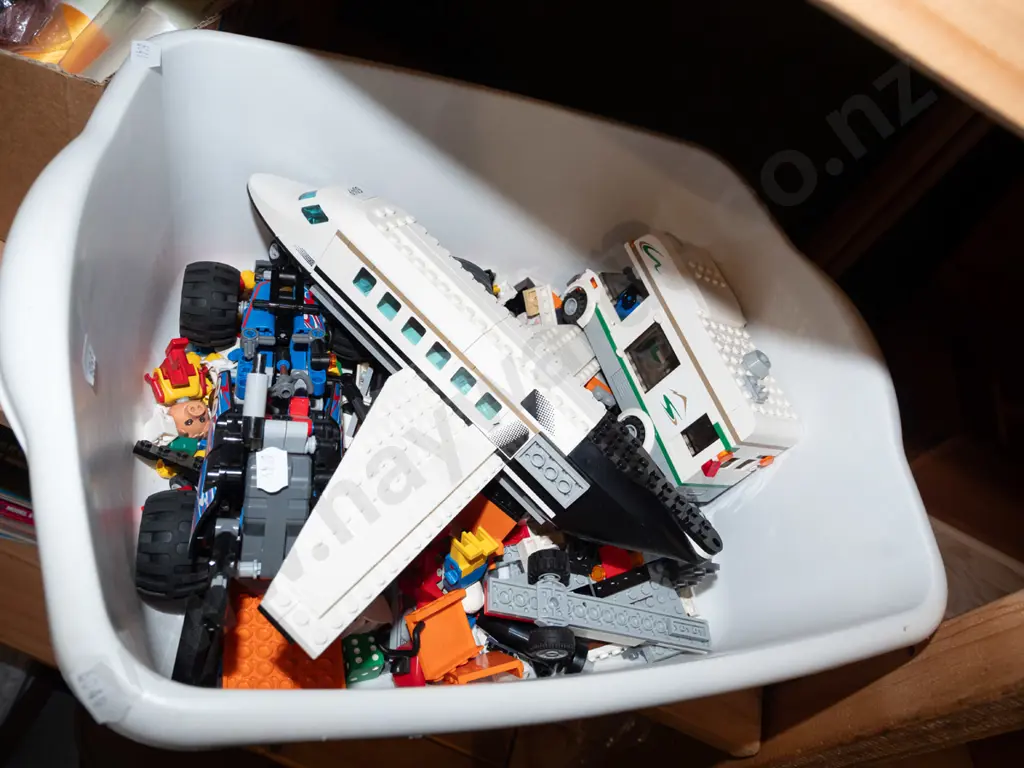 tub of Lego models and pieces Image 1++
