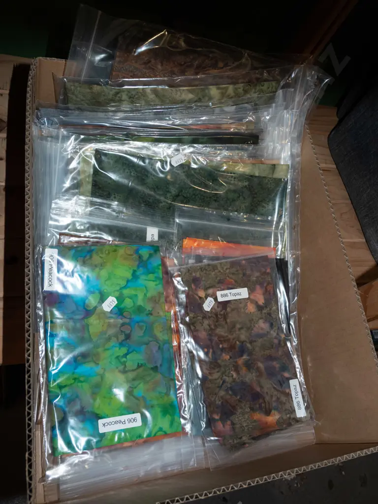 box of fabric pieces Image 1++