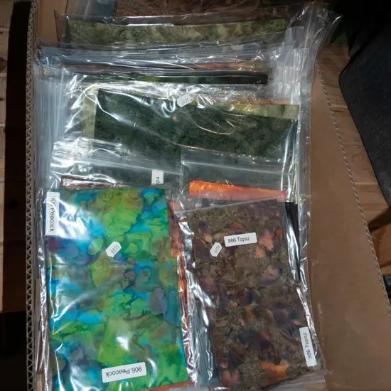 box of fabric pieces
