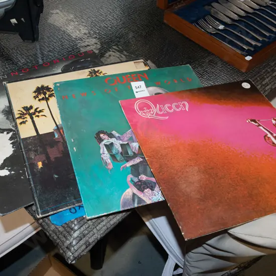 stack of LPs; Queen, The Eagels, Duran Duran - poor condition