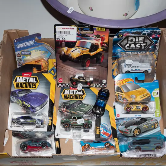box of carded Hotwheels and Zuru diecast vehicles