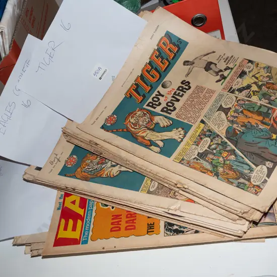 stack of 1960s Tiger and Eagle comics