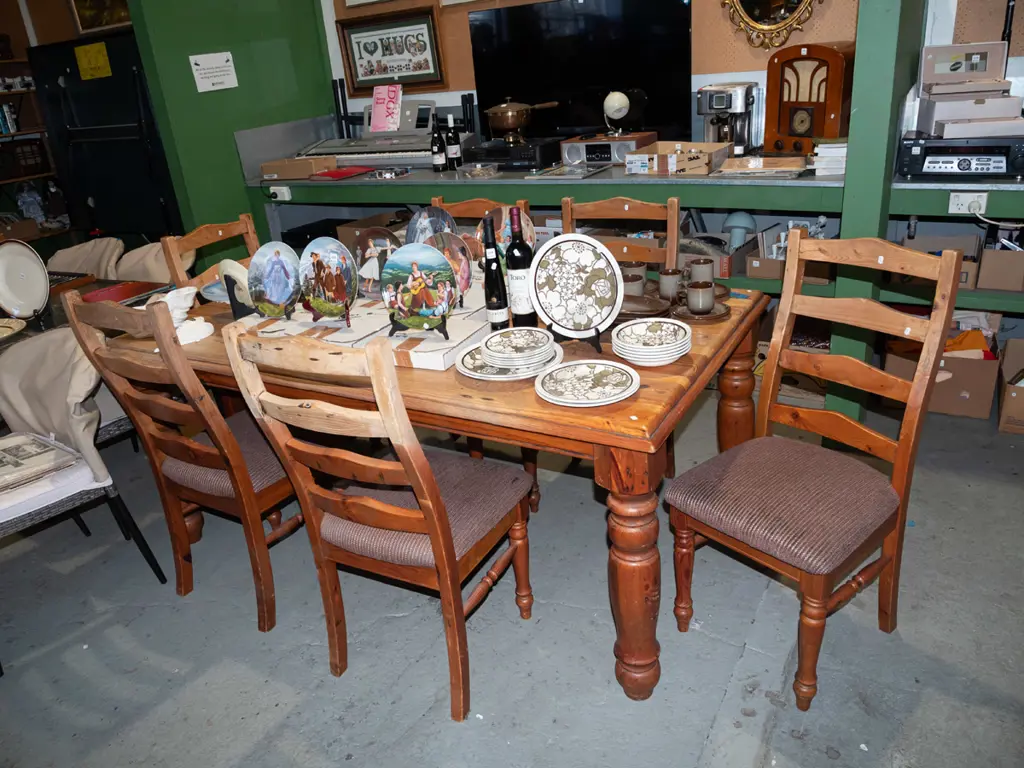solid pine dining table with 6 matching ladder back chairs - some wear and markings to varnish Image 1++