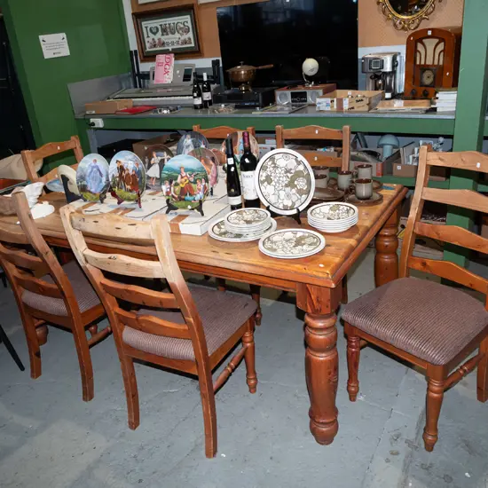 solid pine dining table with 6 matching ladder back chairs - some wear and markings to varnish