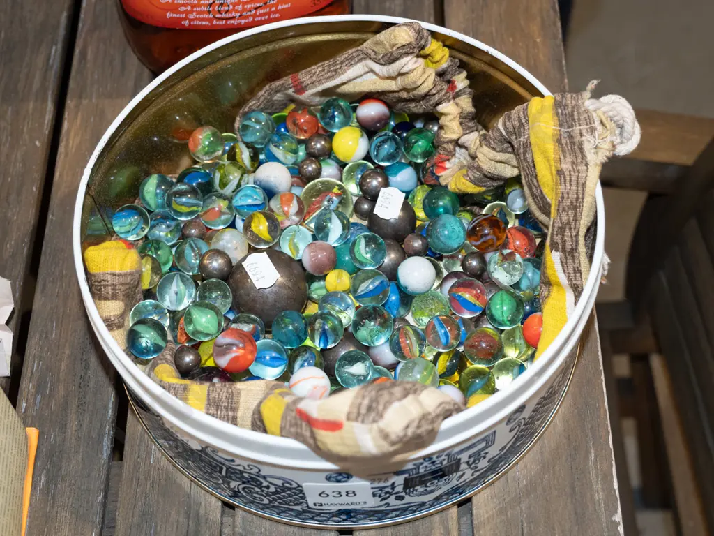 tin of various marbles Image 1++