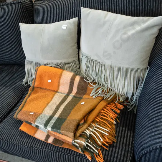 2x suede tasselled cushions, orange woollen blanket