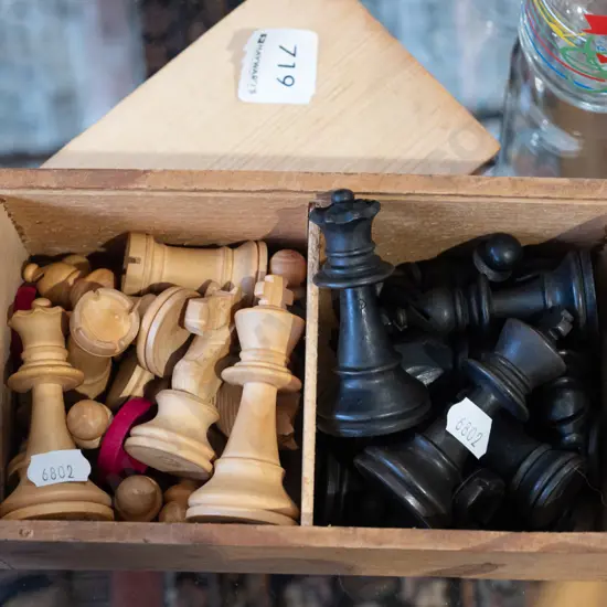 wooden chess pieces in box