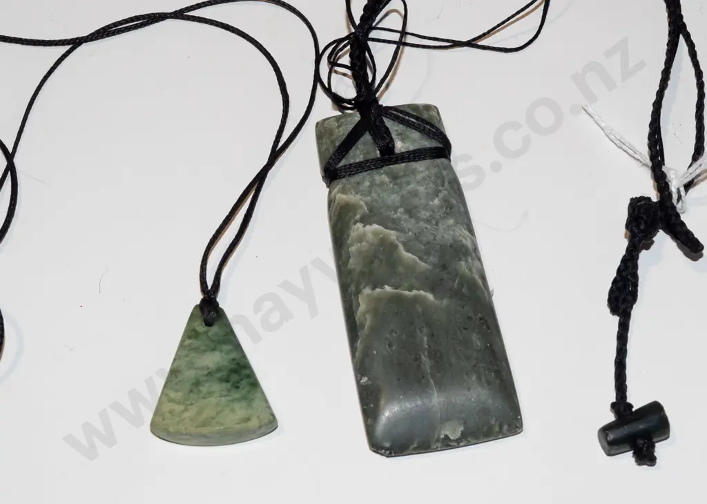 2x green-stone pendants on cord Image 1++