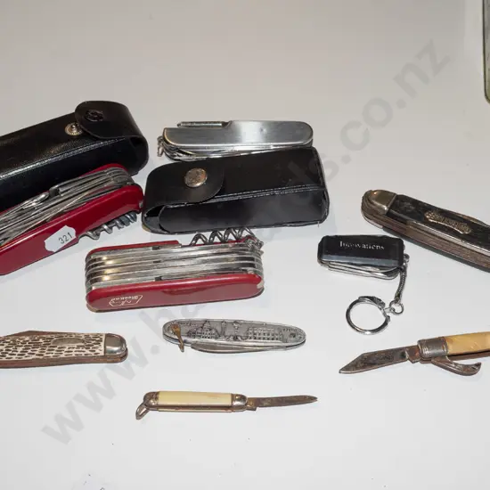 tin of assorted pocket knives