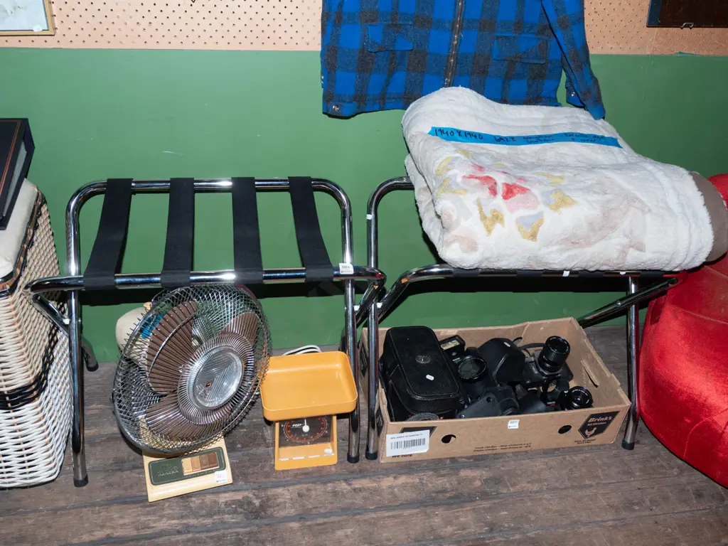 pair of chrome and black strapping luggage stands Image 1++