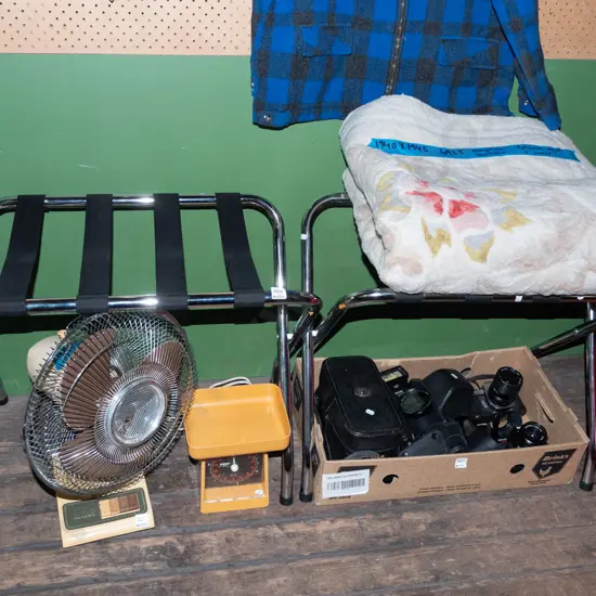 pair of chrome and black strapping luggage stands