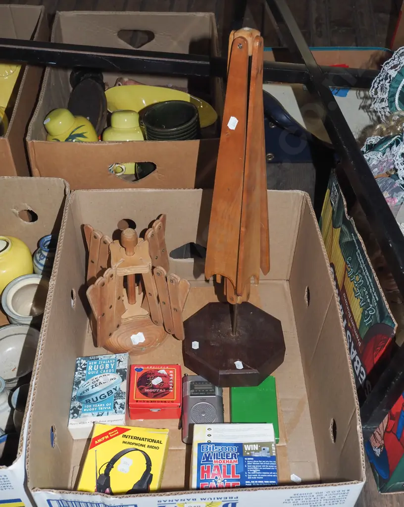 box; 2x small wooden airing racks, radio headphones, rugby quiz cards etc Image 1++