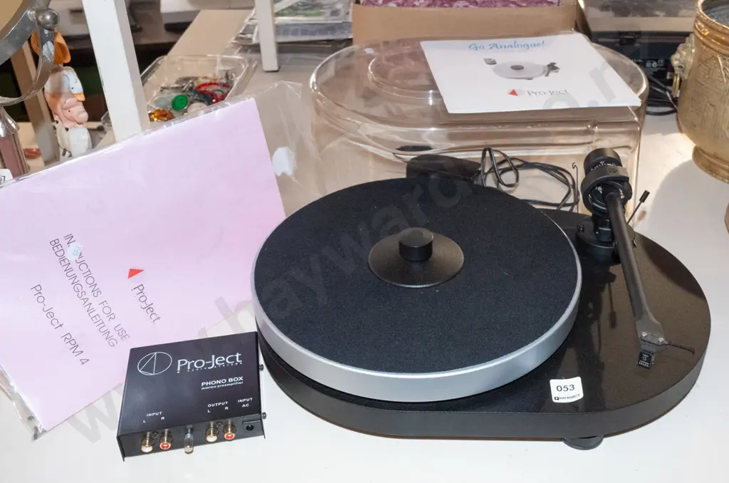 Pro-Ject turntable with dust cover, manuals and Phono Box preamplifier Image 1++