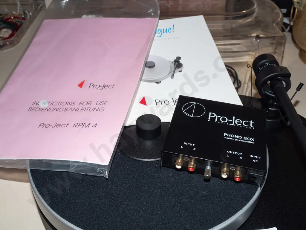 Pro-Ject turntable with dust cover, manuals and Phono Box preamplifier Image 1++