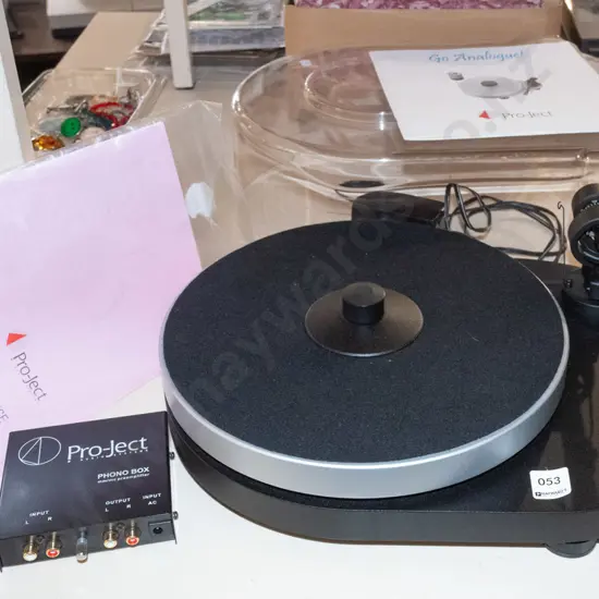 Pro-Ject turntable with dust cover, manuals and Phono Box preamplifier