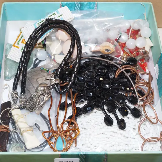 box; various beads, small dolls heads, bone pendant etc