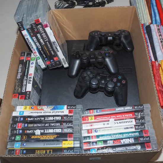 box; ps3 with controllers and various games