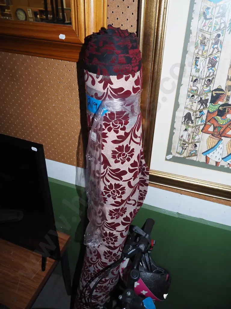 bolt of red and white floral upholstery fabric Image 1++