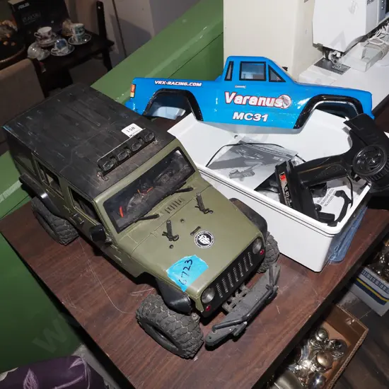 remote control 4WD toy vehicles with blue truck body and controllers - as is no returns