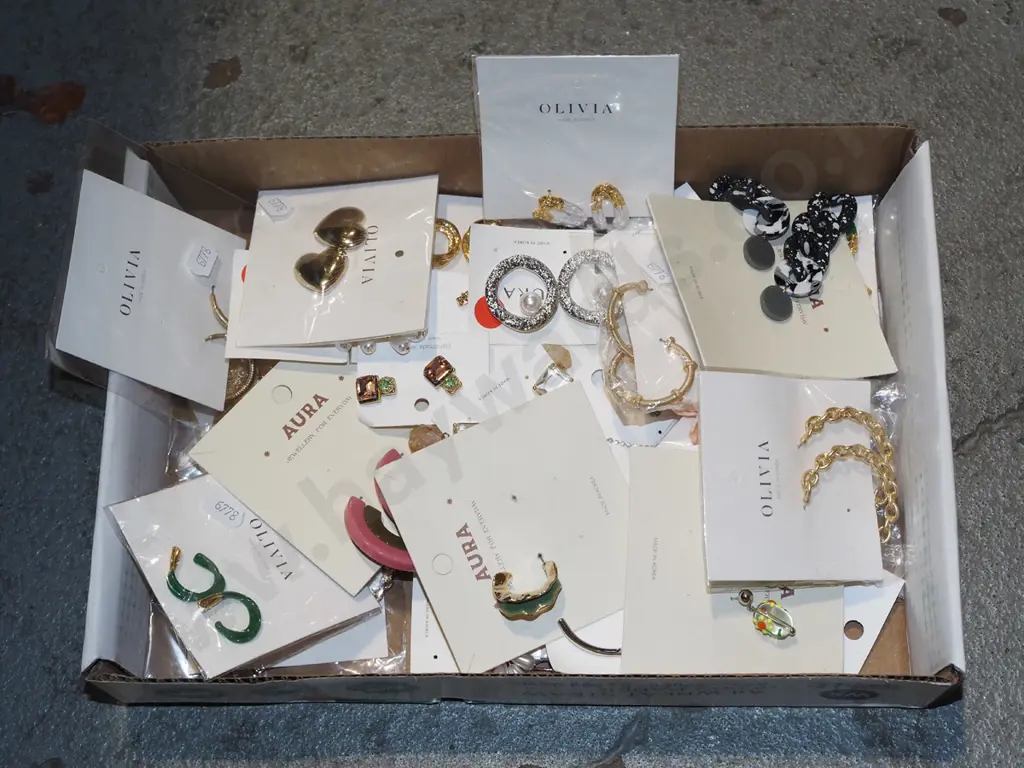 tray of various earrings Image 1++