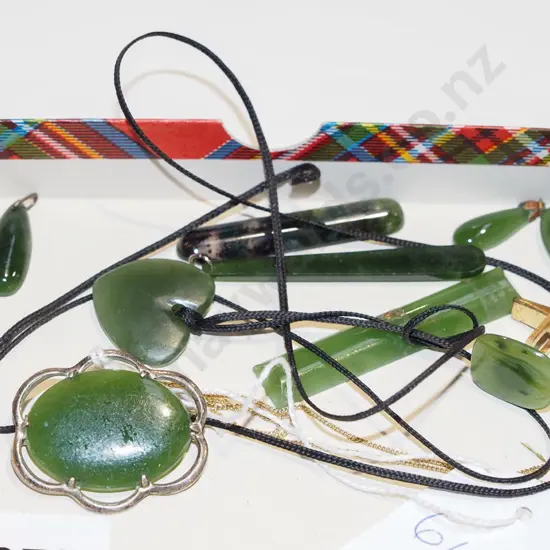 tray of green stone jewellery