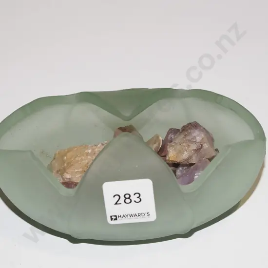 green glass dish and gemstones