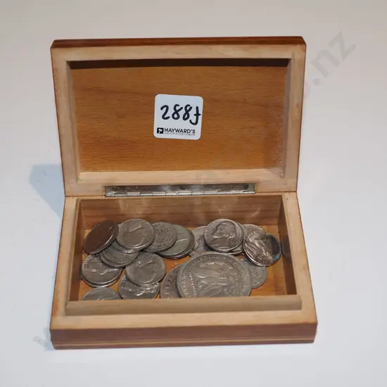 wooden trinket box of coins