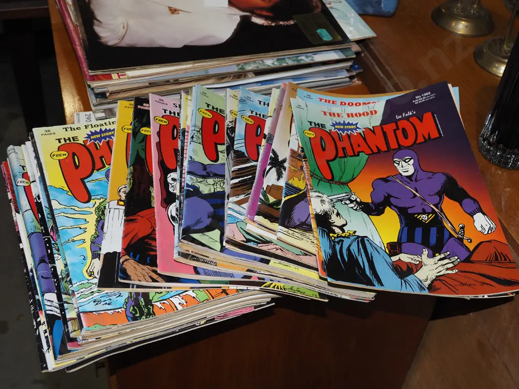 stack of Phantom comics Image 1++