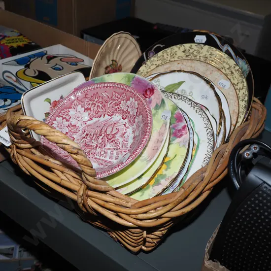 cane basket; plates, saucers, bowls