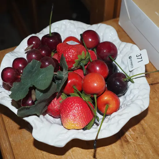 leaf shaped bowl with plastic cherries, grapes and strawberries