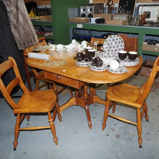 solid pine pedestal dropside kitchen table with 1 internal drawer and 4 ladder back chairs