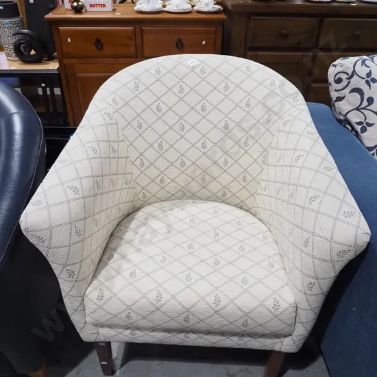 cream patterned upholstered tub chair