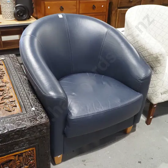 navy blue leather upholstered tub chair
