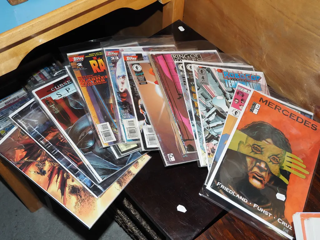 stack of graphic novels comics Image 1++