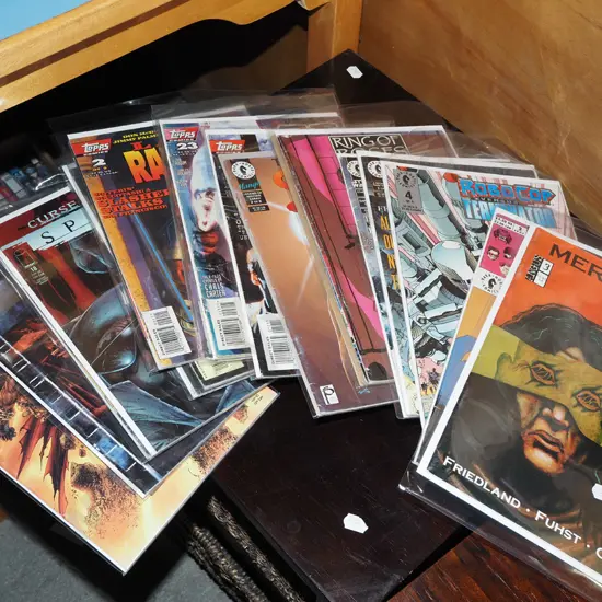 stack of graphic novels comics