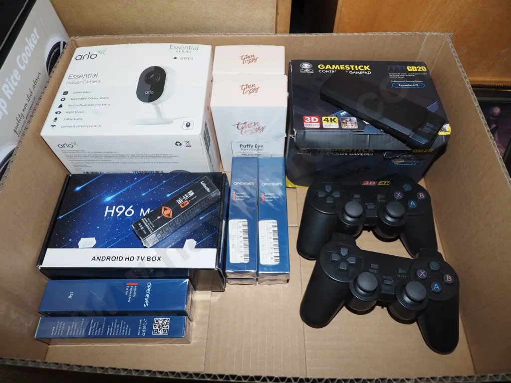 box; playstation controllers, thin lizzy puffy eye, digital camera etc Image 1++