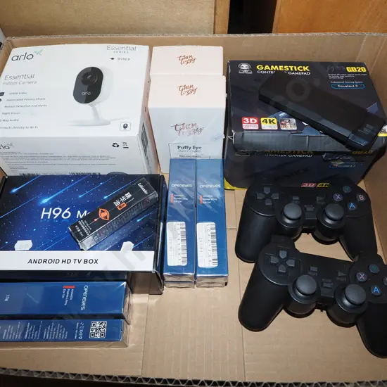 box; playstation controllers, thin lizzy puffy eye, digital camera etc