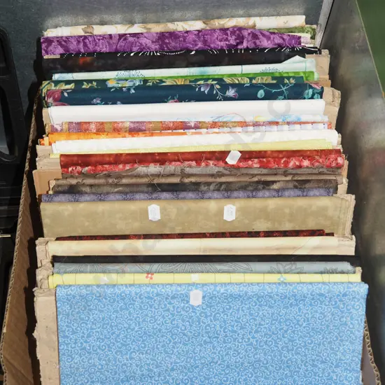 box of fabric pieces
