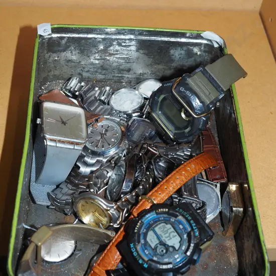 tin of watches - as is no returns