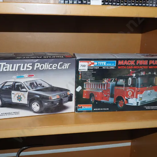 2x yet to be assembled plastic model vehicles